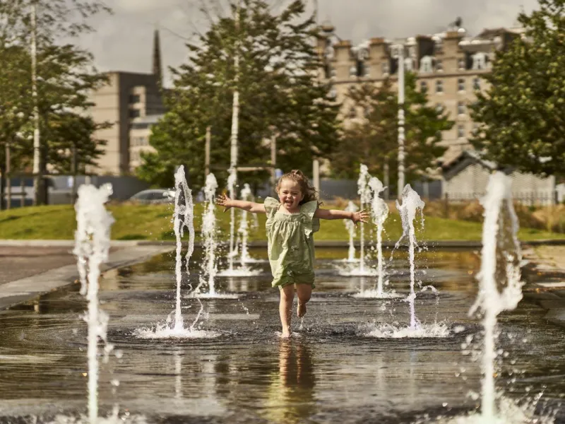 Girl in fountains Dundee Waterfront