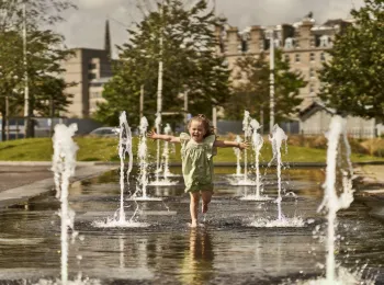 Girl in fountains Dundee Waterfront