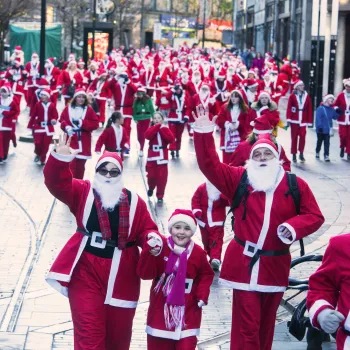 A group of runners in Santa suits