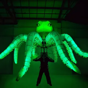 A giant glowing octopus puppet