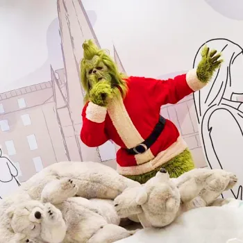 Image of The Grinch making a "Shh..." motion